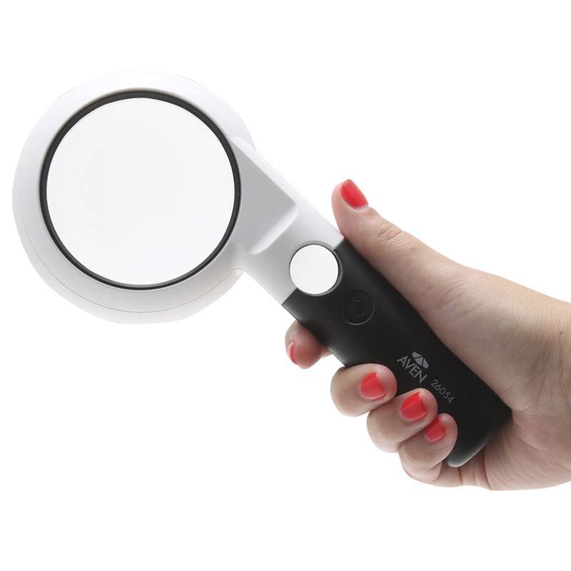 hand holding large aperture magnifier