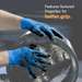 greasy gloved hands working on machinery