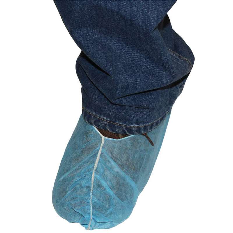 blue shoe cover over black sneaker and partial leg