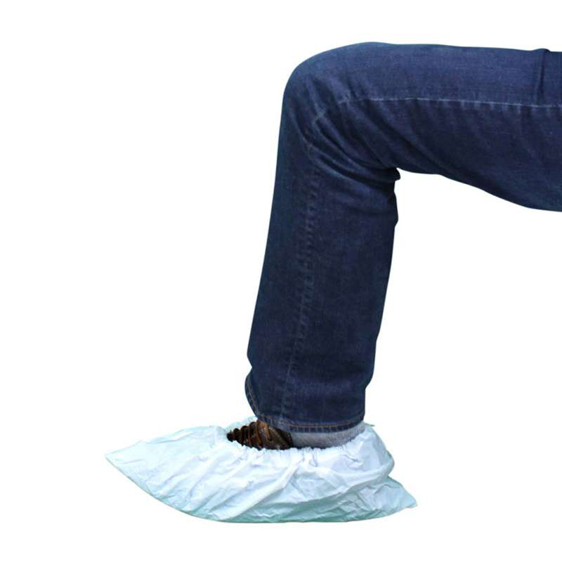 textured white shoe cover over black sneaker